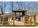Relax in this backyard gazebo with a seating area, perfect for outdoor gatherings and enjoying the serene surroundings at 245 Raleigh Way, Villa Rica, GA 30180