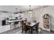 Modern kitchen with white cabinets, stainless steel appliances, and a breakfast bar at 245 Raleigh Way, Villa Rica, GA 30180