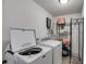 Bright laundry room with modern washer and dryer and plenty of storage space at 245 Raleigh Way, Villa Rica, GA 30180