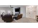 Spacious living room with a modern fireplace, large tv, and cozy seating at 245 Raleigh Way, Villa Rica, GA 30180