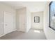 A brightly lit bedroom with large windows and two doors at 472 Martin Se St # 1, Atlanta, GA 30312