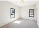 Bright bedroom with neutral walls, plush carpeting, and dual windows that provide natural light at 472 Martin Se St # 1, Atlanta, GA 30312