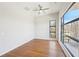 Bright bedroom with large windows, hardwood floors, and modern ceiling fan at 472 Martin Se St # 1, Atlanta, GA 30312