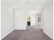 Carpeted bedroom featuring three large windows for ample natural light, modern lighting and neutral decor at 472 Martin Se St # 1, Atlanta, GA 30312