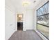 Carpeted bedroom featuring en-suite bathroom access, neutral walls, and modern lighting at 472 Martin Se St # 1, Atlanta, GA 30312