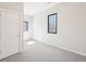 Neutral bedroom with carpet, door and two windows at 472 Martin Se St # 1, Atlanta, GA 30312