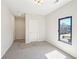 Bedroom featuring a neutral carpet, white walls, and ample natural light at 472 Martin Se St # 1, Atlanta, GA 30312
