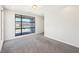 Bright, modern, and carpeted, the bedroom boasts a large window and easy access to another area at 472 Martin Se St # 1, Atlanta, GA 30312