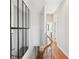 Bright hallway with hardwood floors and modern railings at 472 Martin Se St # 1, Atlanta, GA 30312