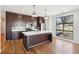 Gourmet kitchen featuring an island, stainless steel appliances, and a window with a view at 472 Martin Se St # 1, Atlanta, GA 30312