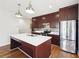 Modern kitchen with stainless steel appliances, island, and ample counter space for cooking at 472 Martin Se St # 1, Atlanta, GA 30312