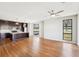 Spacious living room with hardwood floors, modern ceiling fan, and open access to the kitchen at 472 Martin Se St # 1, Atlanta, GA 30312