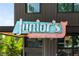Charming storefront featuring Junior's Pizza neon signage with a retro arrow at 472 Martin Se St # 1, Atlanta, GA 30312