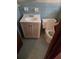 Bathroom features a vanity with storage and a standard toilet at 1404 Aniwaka Sw Ave, Atlanta, GA 30311