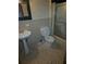 Bathroom with pedestal sink and shower at 1404 Aniwaka Sw Ave, Atlanta, GA 30311