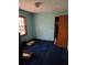 Bedroom with blue carpet, neutral paint, and closet at 1404 Aniwaka Sw Ave, Atlanta, GA 30311