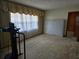 Bedroom with beige carpet, bright windows, and ample natural light at 1404 Aniwaka Sw Ave, Atlanta, GA 30311