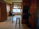 Bright kitchen with original wood paneling and a breakfast bar area at 1404 Aniwaka Sw Ave, Atlanta, GA 30311
