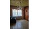Cozy seating area with a chandelier and large windows overlooking the backyard at 1404 Aniwaka Sw Ave, Atlanta, GA 30311