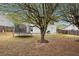 Expansive backyard featuring mature trees, a trampoline, and a storage shed, ideal for outdoor living at 2172 Creekview Trl, Decatur, GA 30035