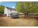Large backyard with mature trees, a trampoline, and plenty of space for entertainment at 2172 Creekview Trl, Decatur, GA 30035