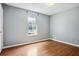 Bedroom featuring neutral walls, vinyl wood flooring, and a window at 2172 Creekview Trl, Decatur, GA 30035