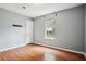 Bedroom featuring neutral walls, vinyl wood flooring, and a window at 2172 Creekview Trl, Decatur, GA 30035
