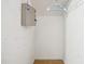 Small closet with electrical panel, rod, and hanger, ready for storage at 2172 Creekview Trl, Decatur, GA 30035