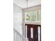 Elegant entryway featuring a staircase, chandelier, and front door with decorative glass panels at 2172 Creekview Trl, Decatur, GA 30035