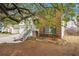 Quaint home showcasing brickwork and siding with an entrance via stairs and a well-kept lawn at 2172 Creekview Trl, Decatur, GA 30035