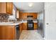 The kitchen features updated appliances, stone backsplash, and tiled floors at 2172 Creekview Trl, Decatur, GA 30035
