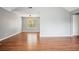 Open concept living room featuring hardwood floors, neutral paint, and lots of natural light at 2172 Creekview Trl, Decatur, GA 30035