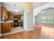 Open living area flows into the kitchen, featuring hardwood floors and natural light at 2172 Creekview Trl, Decatur, GA 30035