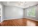 Large main bedroom with hardwood floors, ceiling fan, and tray ceilings at 2172 Creekview Trl, Decatur, GA 30035