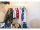 Organized closet features ample storage with shelving and hanging space with additional storage below at 3302 Waldrop Trl, Decatur, GA 30034