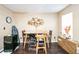 Dining room with dark wood floors, a large wall decor, and minimalist furniture at 3302 Waldrop Trl, Decatur, GA 30034