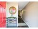 Charming entryway featuring a red door and a stylish shoe rack that adds personality at 3302 Waldrop Trl, Decatur, GA 30034