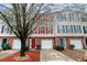 Charming townhomes with brick facades, colorful shutters, and attached garages for convenient parking at 3302 Waldrop Trl, Decatur, GA 30034
