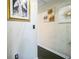 Hallway featuring hardwood floors and artwork hanging on the walls at 3302 Waldrop Trl, Decatur, GA 30034