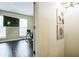 The hallway leads to a study room with a TV, desk, and natural light coming in through the windows at 3302 Waldrop Trl, Decatur, GA 30034