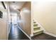 Spacious hallway features sleek floors, access to entry and staircase, with neutral wall paint at 3302 Waldrop Trl, Decatur, GA 30034