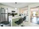 Kitchen featuring white cabinets, stainless steel appliances, and a center island with bar stool seating at 3302 Waldrop Trl, Decatur, GA 30034