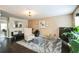 Open living room featuring hardwood floors, neutral decor, and kitchen access at 3302 Waldrop Trl, Decatur, GA 30034