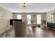 Spacious living room with hardwood floors, plants, and lots of natural light at 3302 Waldrop Trl, Decatur, GA 30034