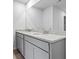 Bathroom with a gray double sink vanity and granite countertops at 818 Major Oak Ct, Villa Rica, GA 30180