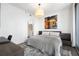 Bedroom with ensuite bathroom access, neutral decor, and a large window with skyline views at 1080 Peachtree Ne St # 1610, Atlanta, GA 30309