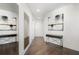 Hallway adorned with modern art and designer console tables, showcasing hardwood flooring and recessed lighting at 1080 Peachtree Ne St # 1610, Atlanta, GA 30309