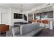 Open-concept living area with stylish furnishings, a modern kitchen, and plenty of natural light at 1080 Peachtree Ne St # 1610, Atlanta, GA 30309