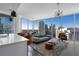 Bright living room featuring modern decor, city views from floor-to-ceiling windows and an open floorplan at 1080 Peachtree Ne St # 1610, Atlanta, GA 30309