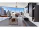 Modern living area with large windows showcasing city views and sleek contemporary furnishings at 1080 Peachtree Ne St # 1610, Atlanta, GA 30309
